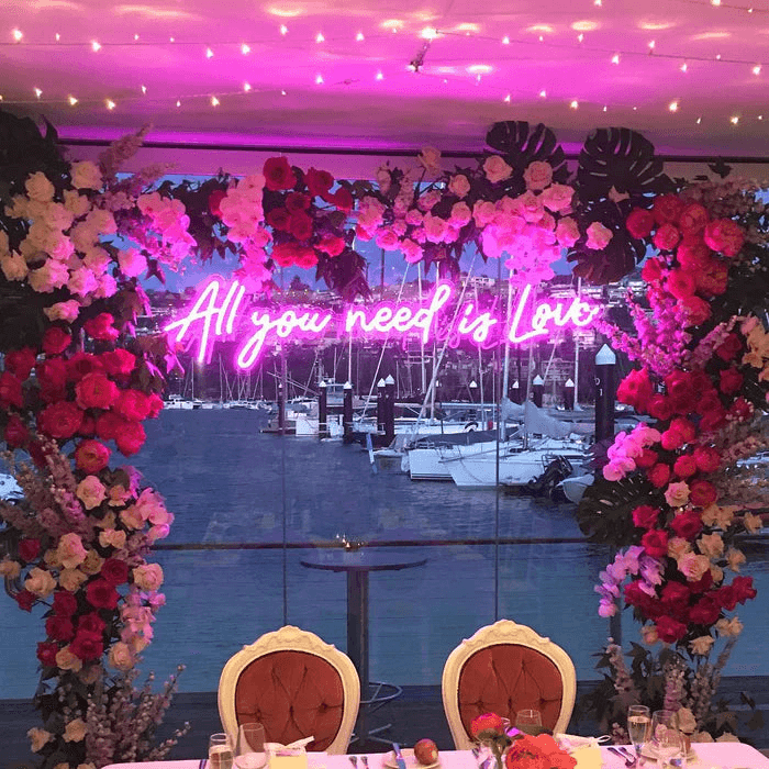 What is the wedding arch with neon sign called?