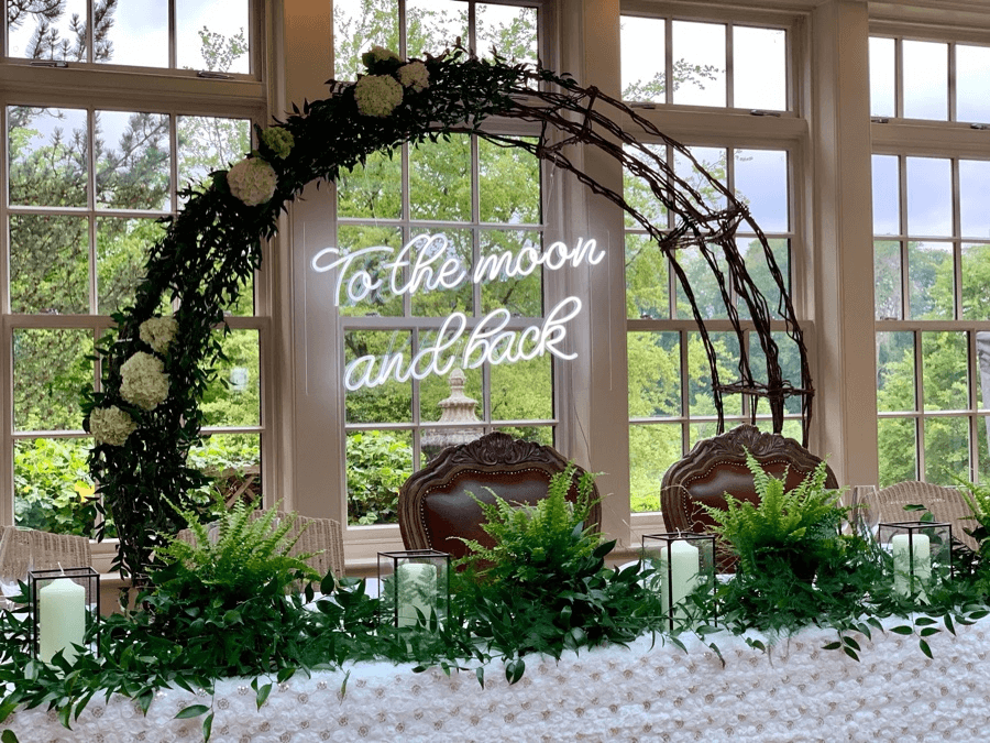 How do you attach a wedding arch with neon sign?